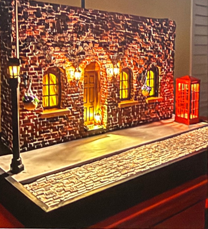 Justin Tucker’s handcrafted 1950s police station street scene with a red telephone booth and glowing streetlamp